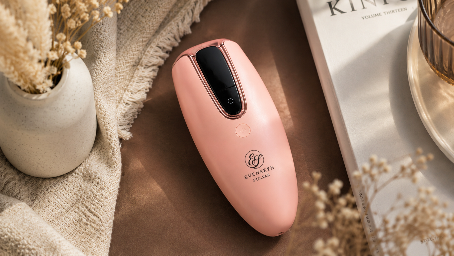 At-home IPL hair-removal handset resting on a bathroom counter in soft daylight