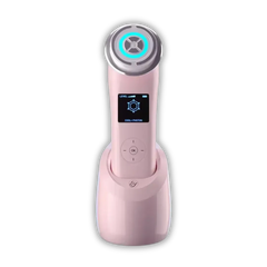 EvenSkyn Lumo⁺ skin tightening handset in pink, standing in its charging dock with the display showing Cool + Photon mode