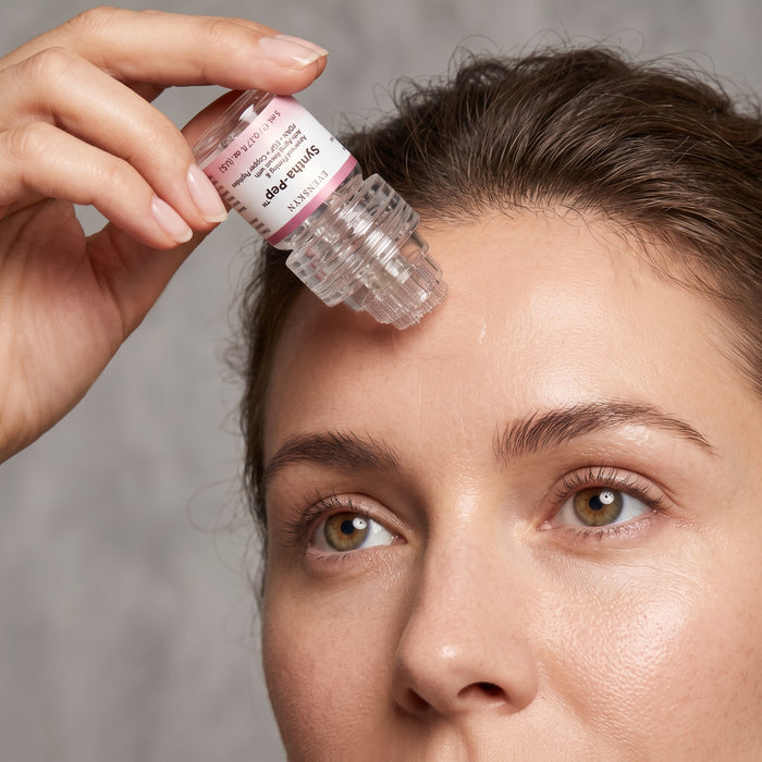 Applicator held straight down onto the forehead, head flat to the skin at 90 degrees