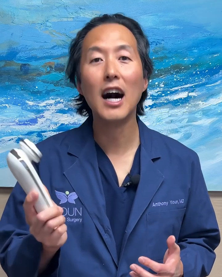 Dr. Anthony Youn holding the original EvenSkyn Lumo